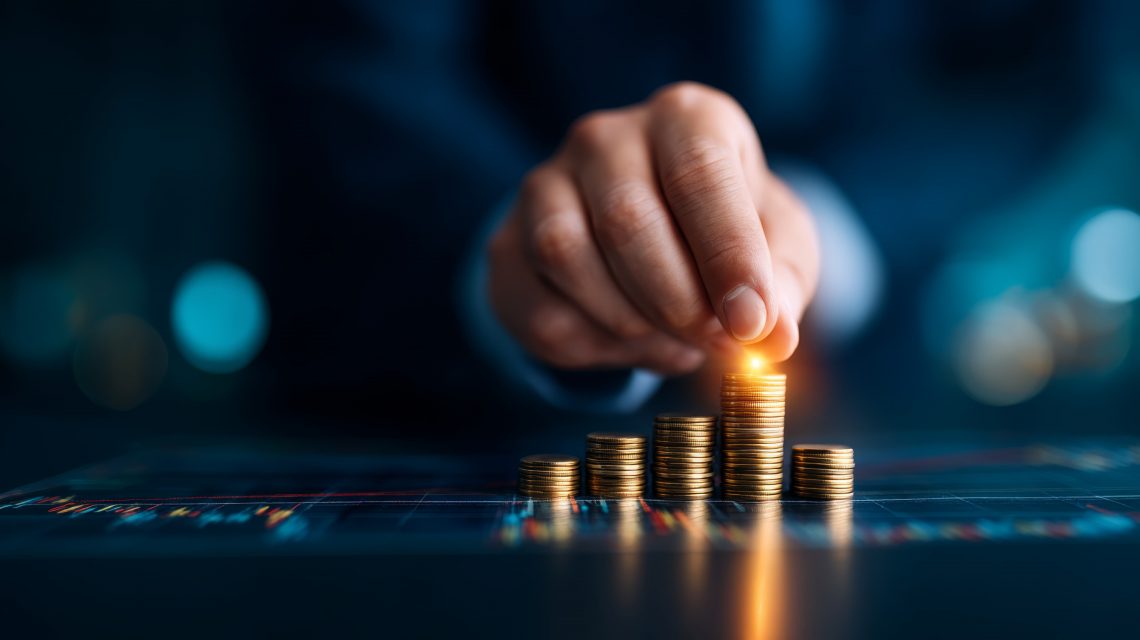 Hand balancing piles of coins