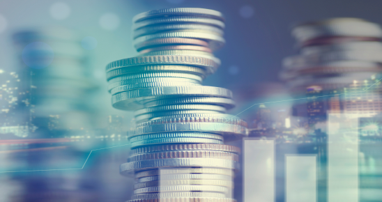 Coins with cityscape and charts